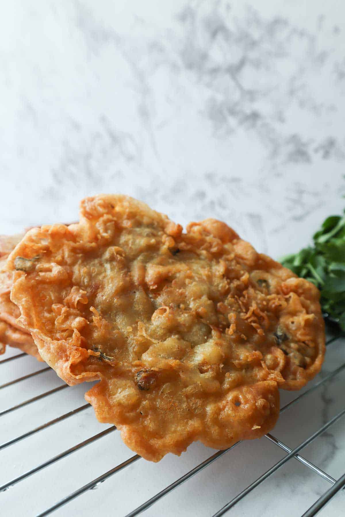 close up of a crispy puerto rican bacalaito.