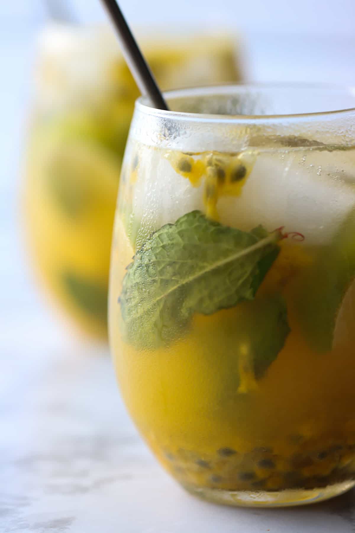 close up of a mojito made with passion fruit.