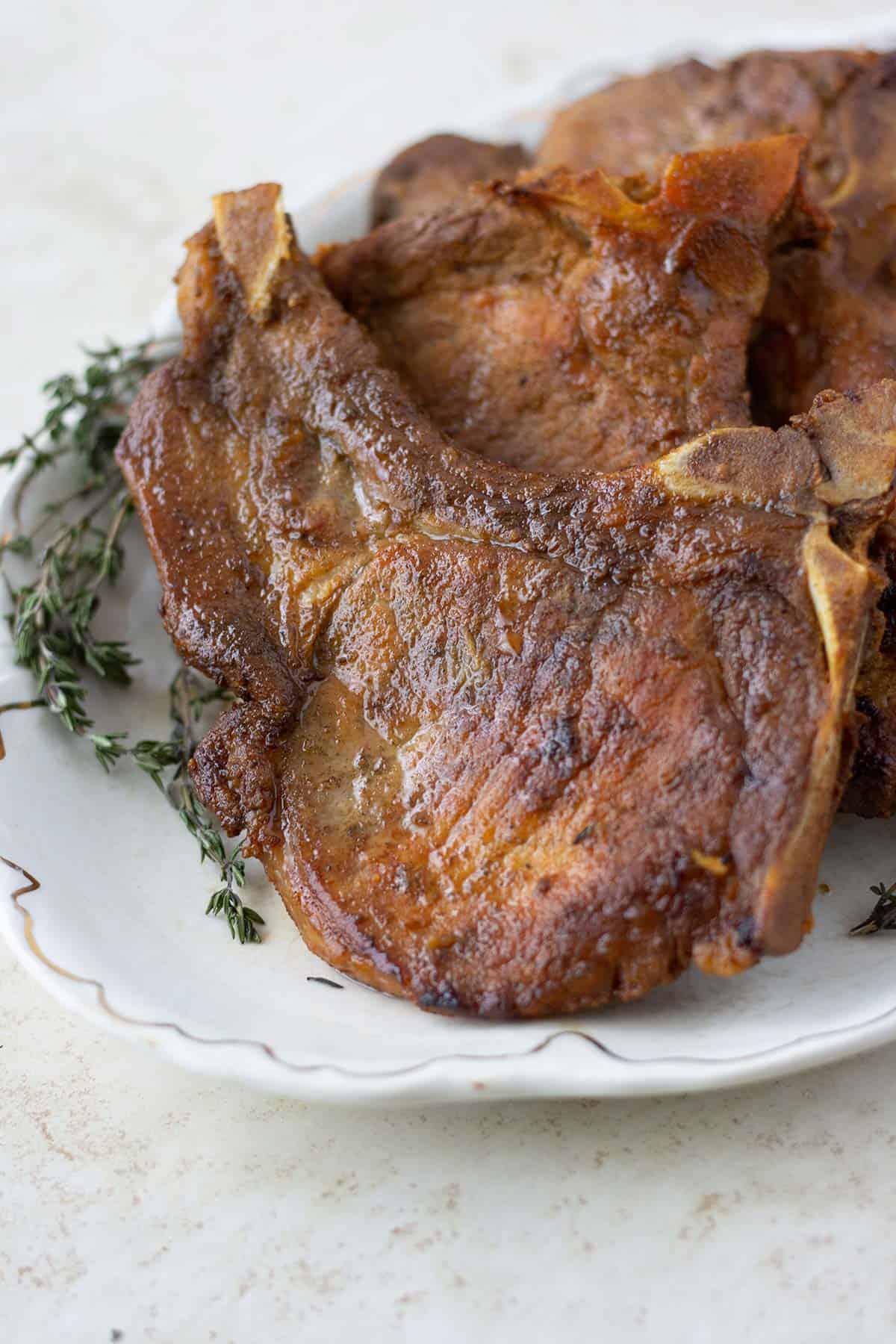 a plate full of chuletas fritas or fried pork chops.