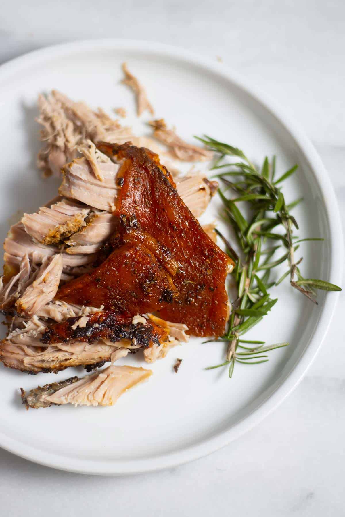 roast pork with crackling on a plate.