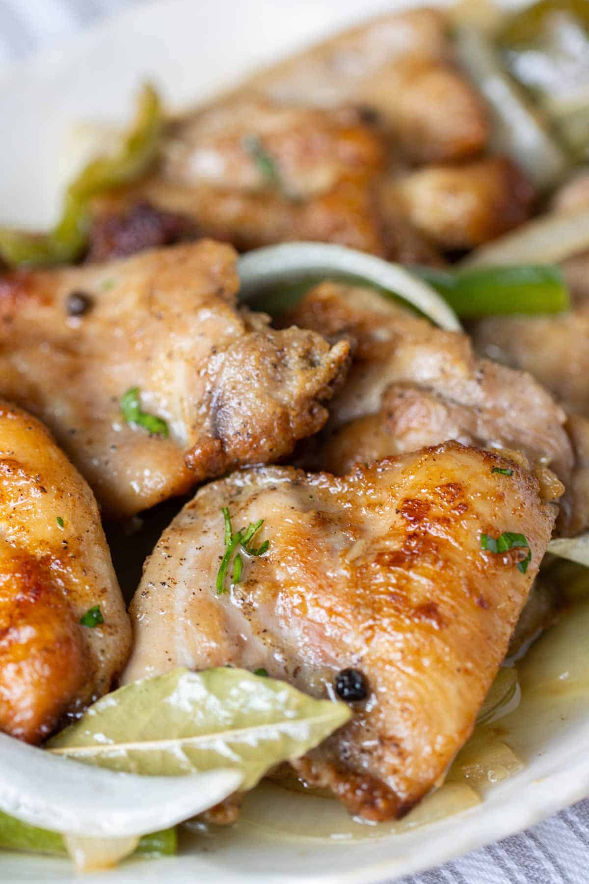 close up of boneless chicken thighs made on a escabeche way.