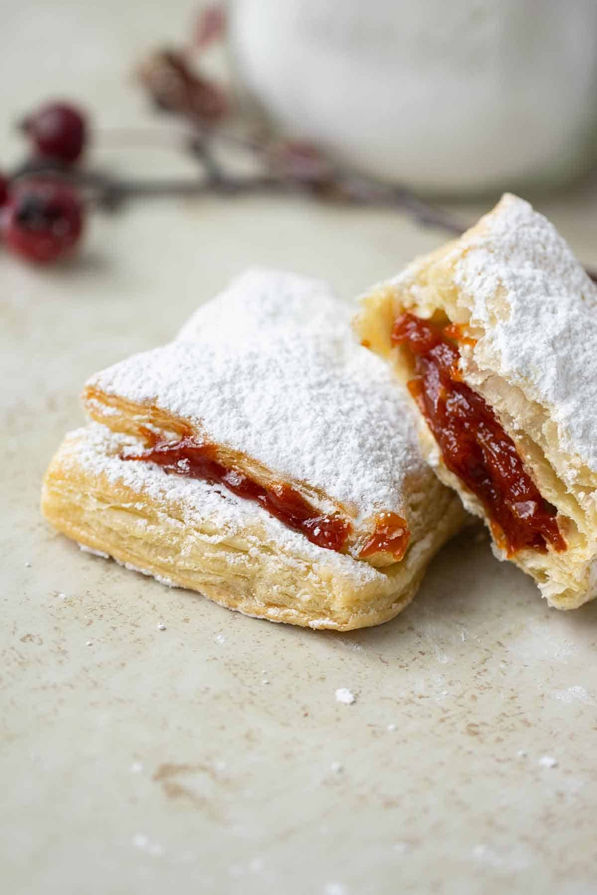 pastelillos de guayaba cut in half.