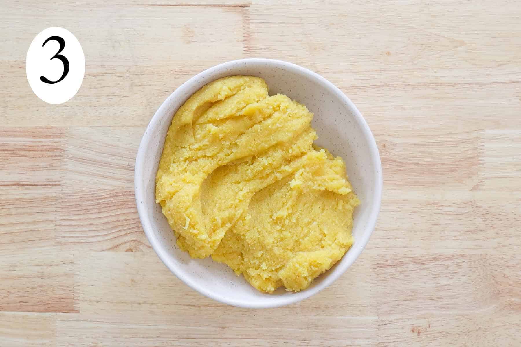a bowl with cooked cornmeal.