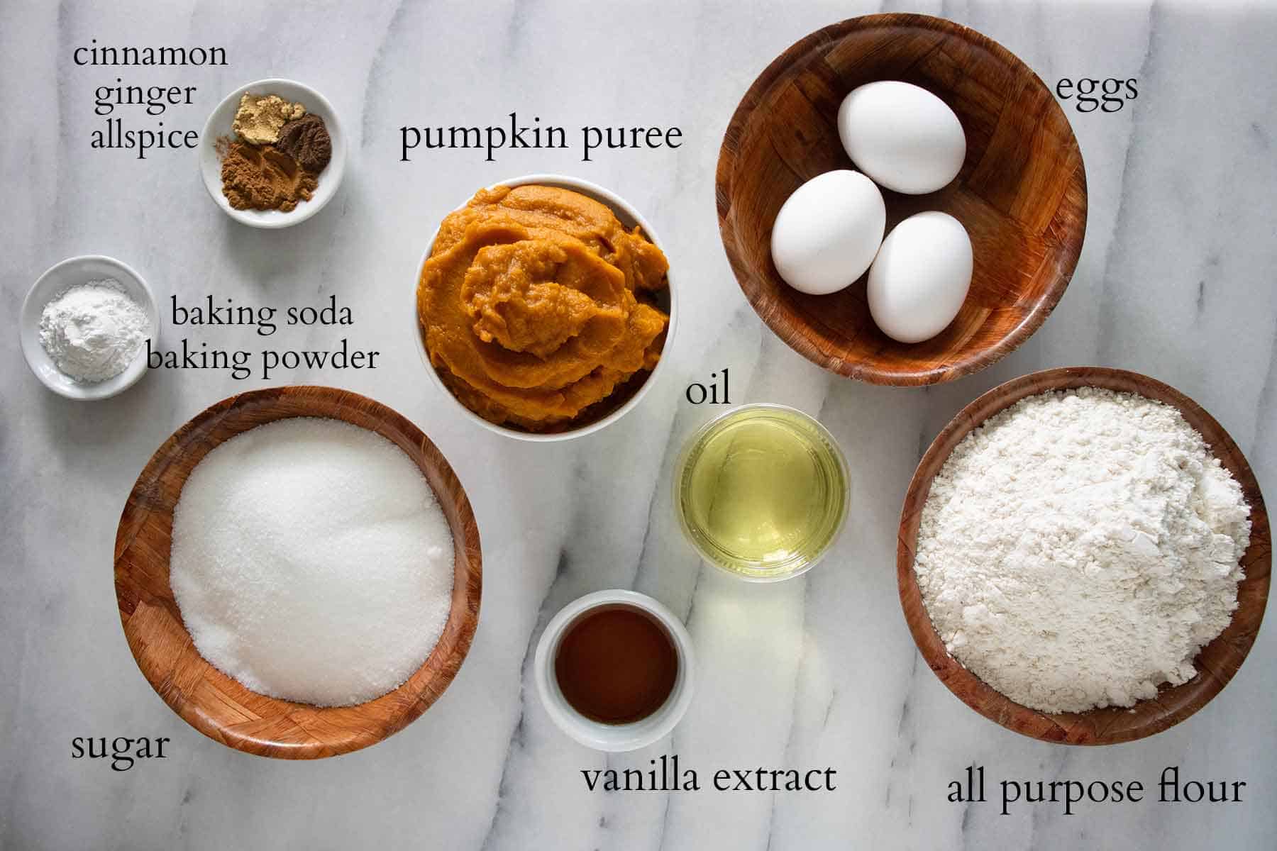 all the ingredients needed to make a pumpkin loaf cake.