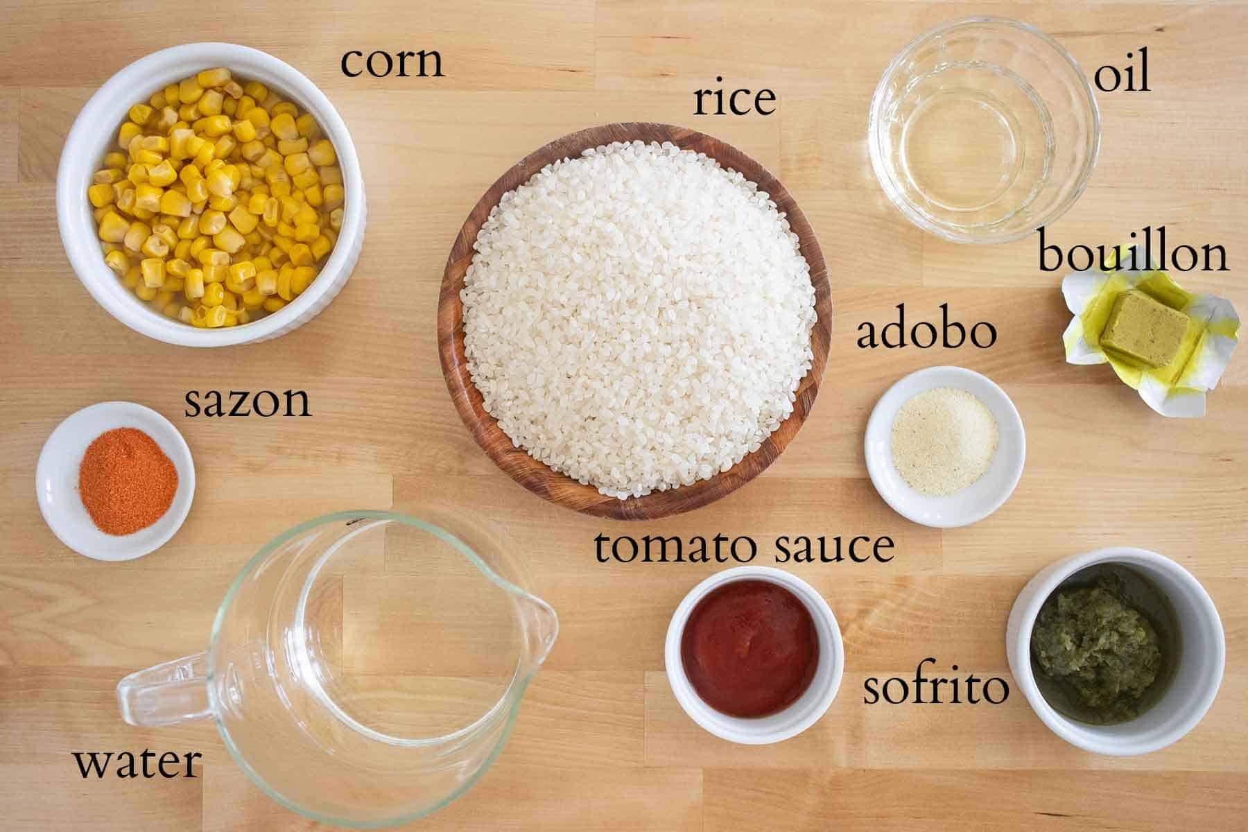 all the ingredients needed to make puerto rican yellow rice with corn.