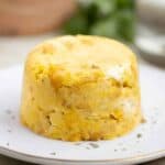 a puerto rican trifongo on a plate garnished with parsley.