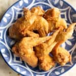a big plate of chine style fried chicken wings.