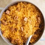 a caldero with puerto rican arroz con jamonilla.