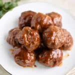 a plate full of puerto rican style baby shower meatballs with guava sauce.