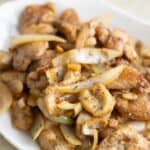 a plate full of a Puerto Rican garlic butter chicken also known as a pollo al ajillo.