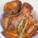 a plate full of puerto rican baked pork chops.