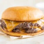 a smash burger double patty with cheese on a brioche burger bun.