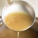 a pan with a laddle full of chicken gravy made without drippings..