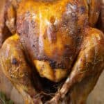 a big turkey made in a Puerto Rican style called pavochon with a thyme stick on the side.