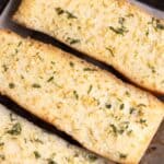 3 half loafs of pan con ajo which is garlic bread made with fresh garlic.