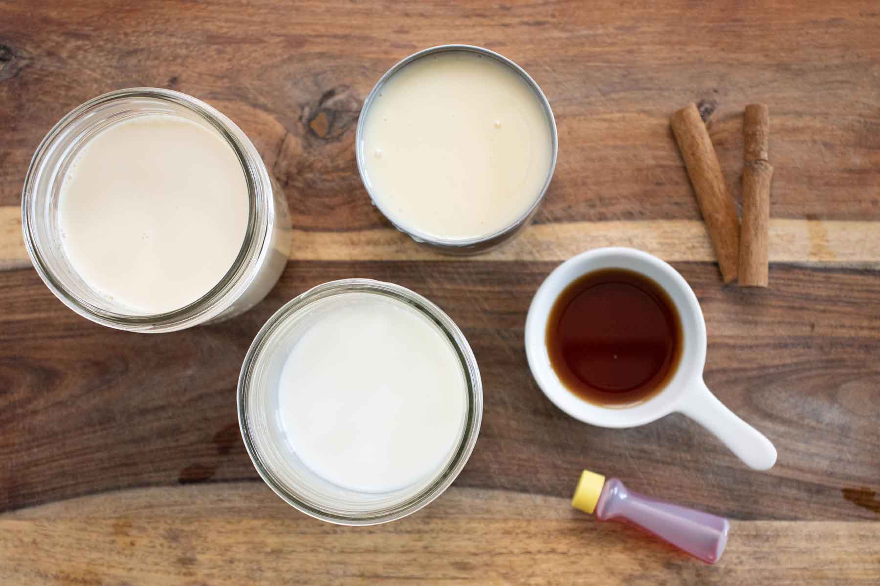 All the ingredients needed to make a piragua de crema or vanilla flavor shaved ice.
