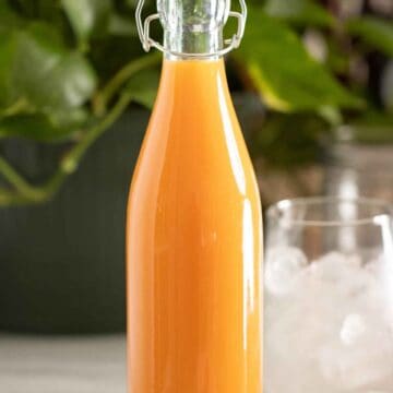 A bottle of homemade ice cream flavor syrup used for puerto rican piraguas and limbers.