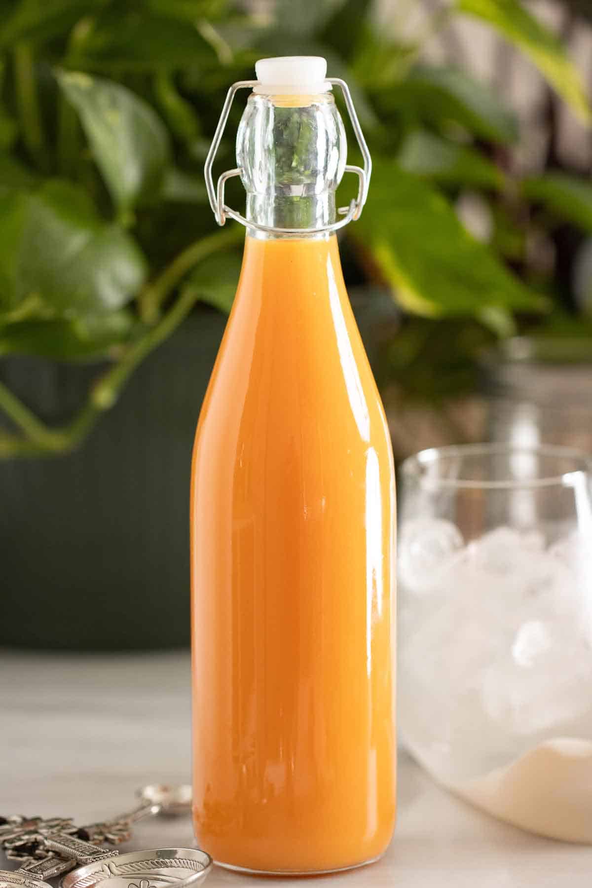 A bottle of homemade ice cream flavor syrup used for puerto rican piraguas and limbers.