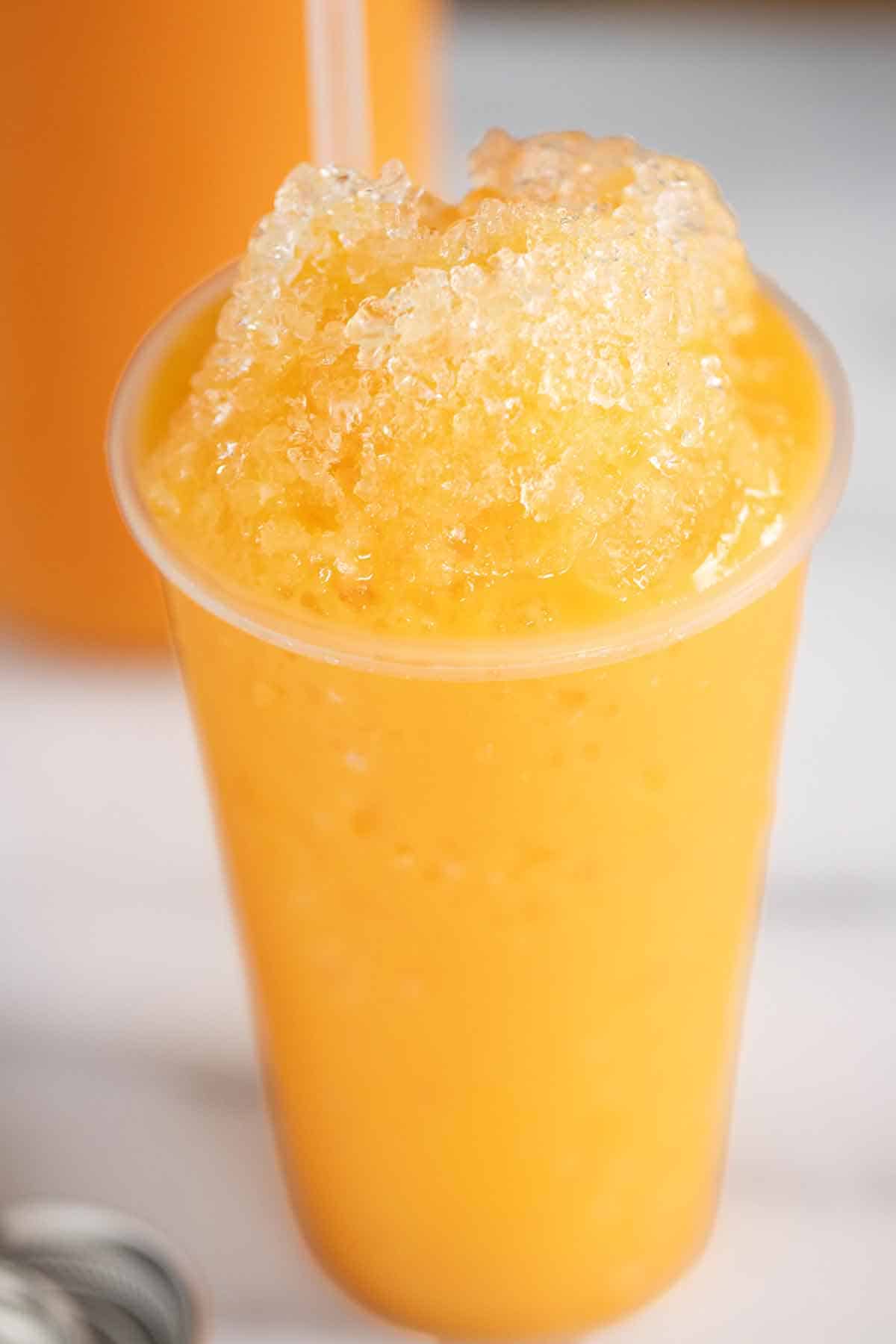 A cup of ice cream flavor shaved ice or piragua de mantecado.