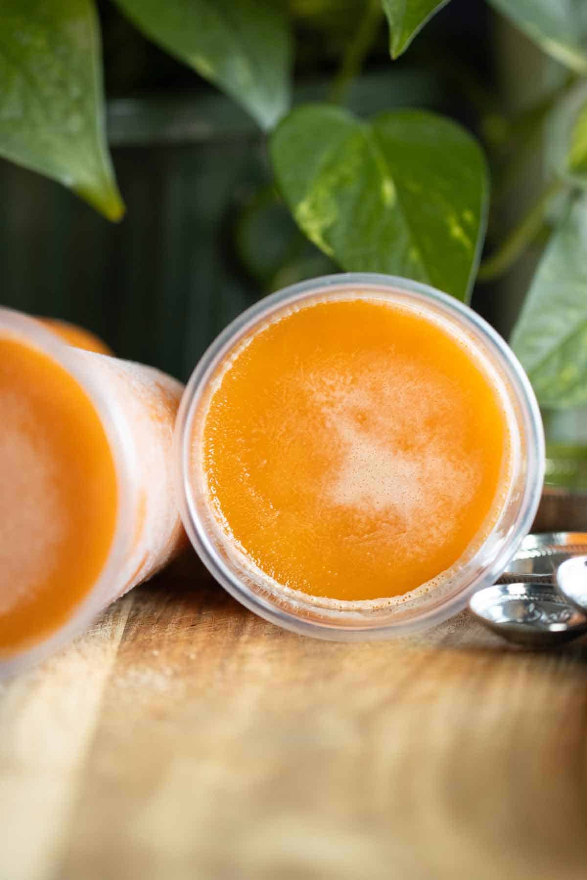 2 Puerto Rican limber de mantecado or ice cream flavor frozen cups on their side.