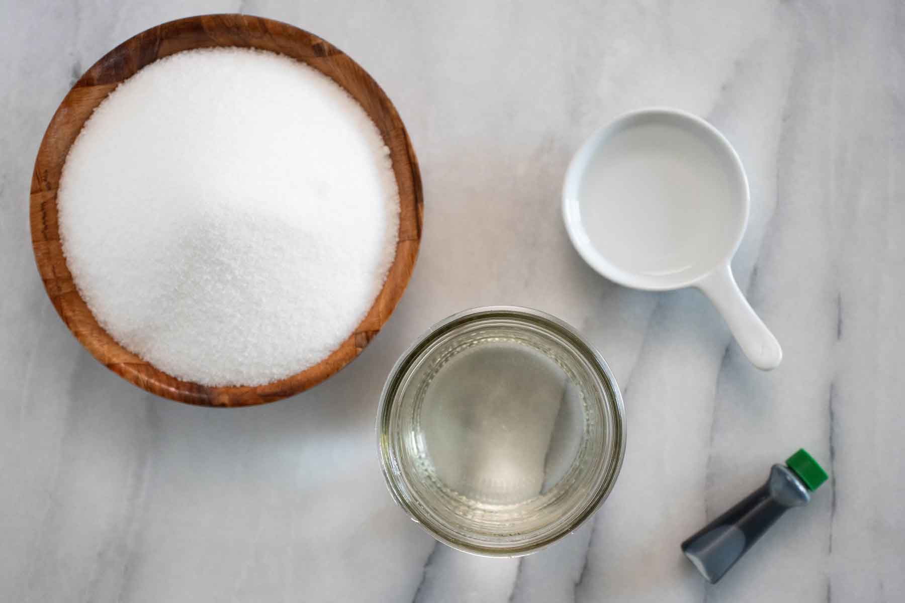 All the ingredients needed to make a homemade mint syrup.