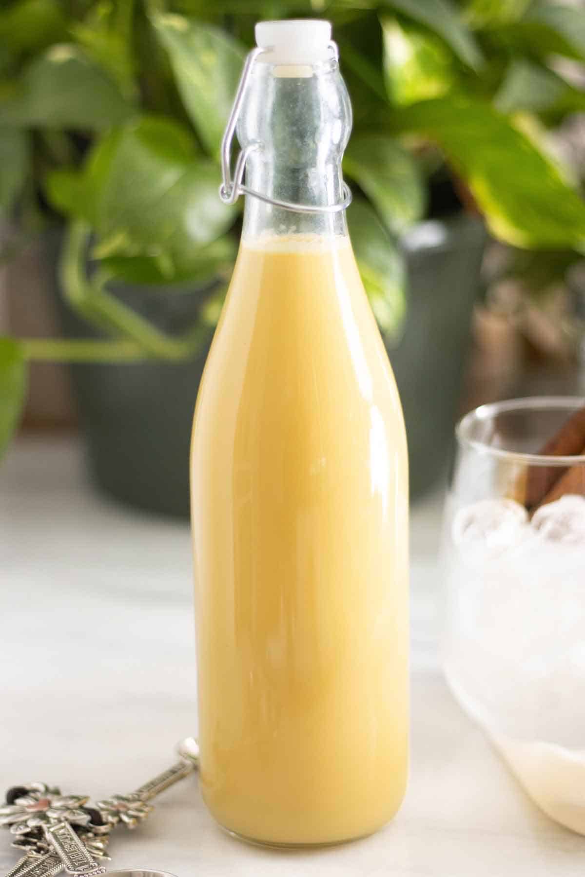 A bottle of homemade vanilla syrup made with different milks.