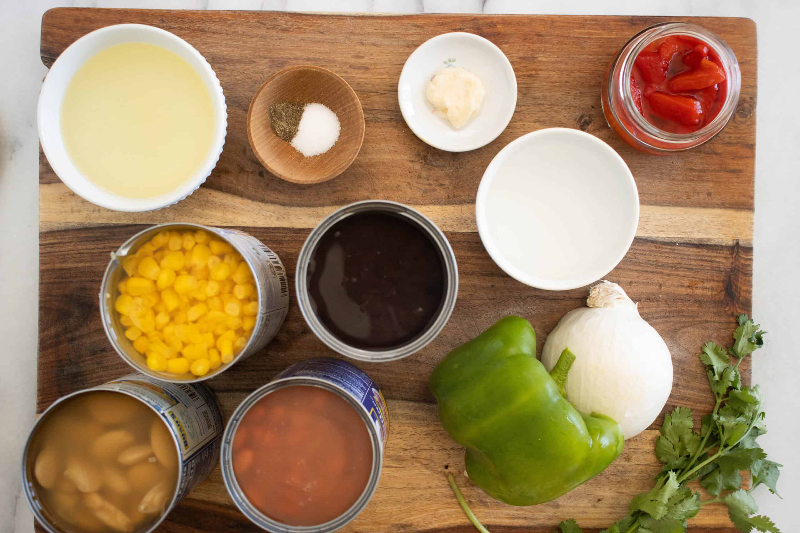 All the ingredients needed to make a puerto rican beans salad.