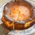 A torta vasca cheesecake with a cut slice.