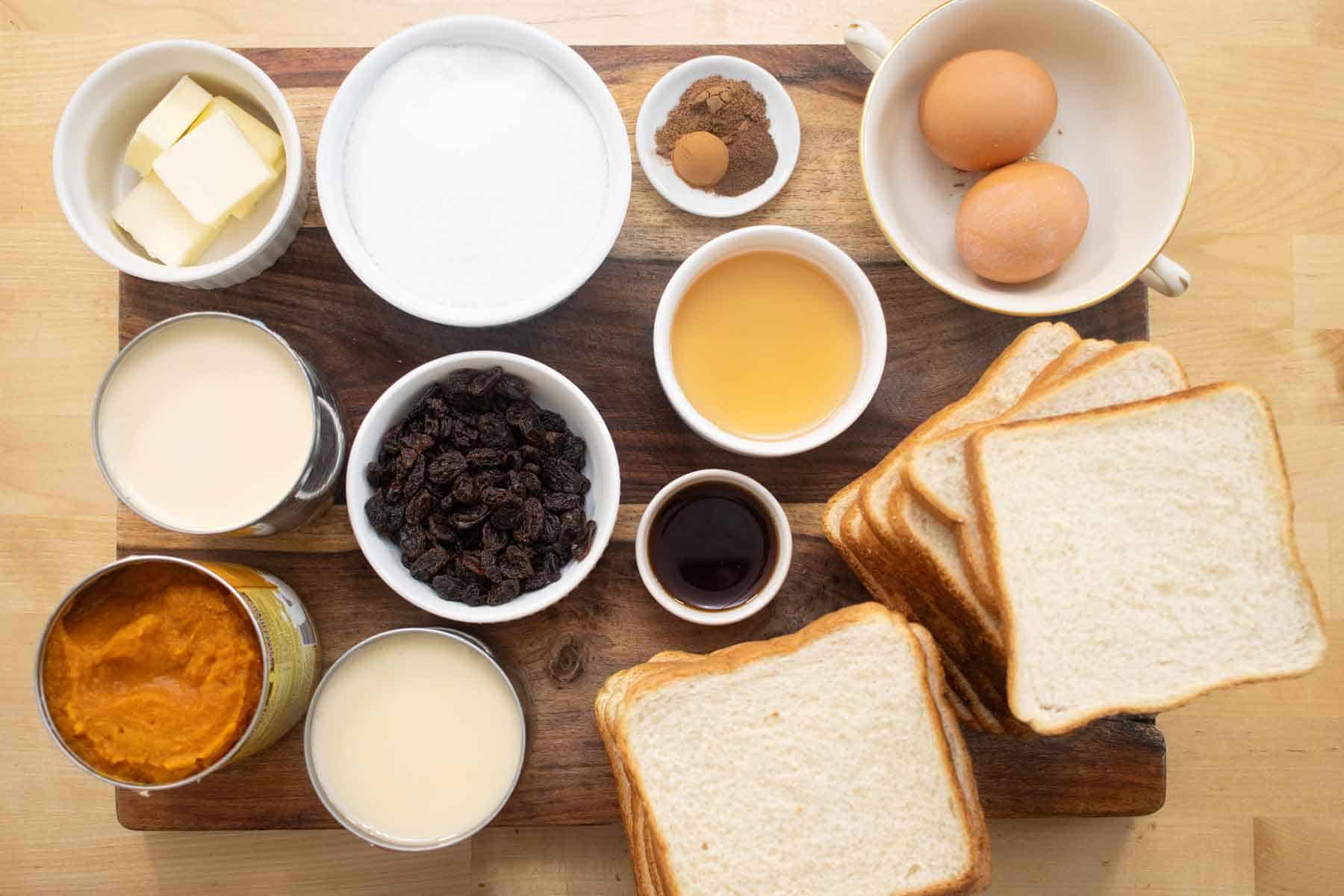 All the ingredients needed to make a pumpkin bread pudding.